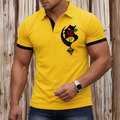 Yellow polo shirt with a black and red design on a wooden background