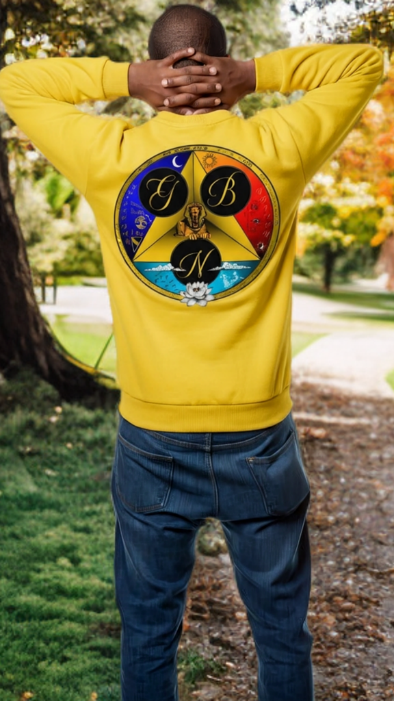 Person wearing a yellow sweatshirt with a colorful logo outdoors