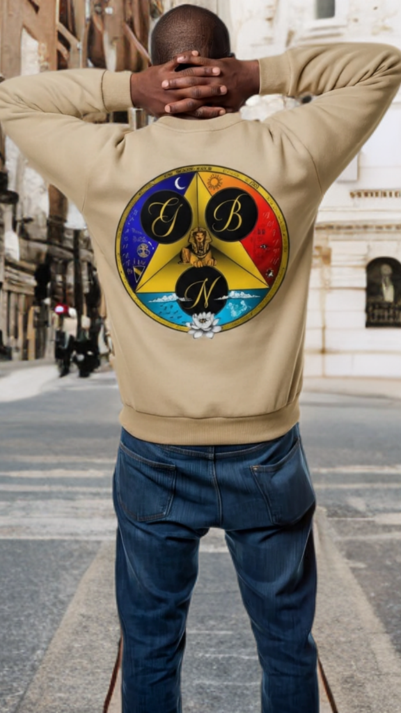 Person wearing a beige sweatshirt with a colorful logo on the back, standing on a city street.