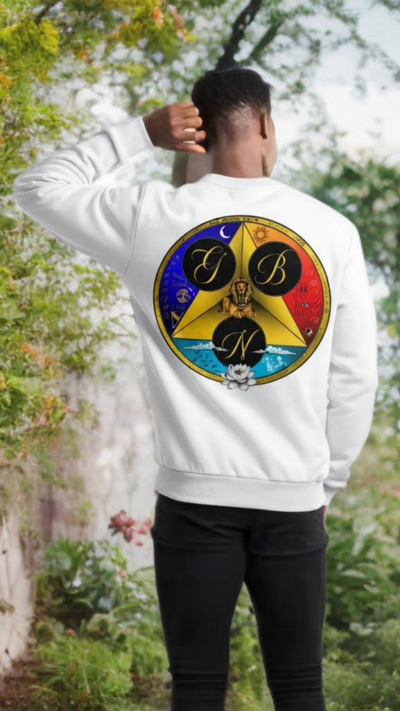 Person wearing a white sweatshirt with a colorful logo outdoors