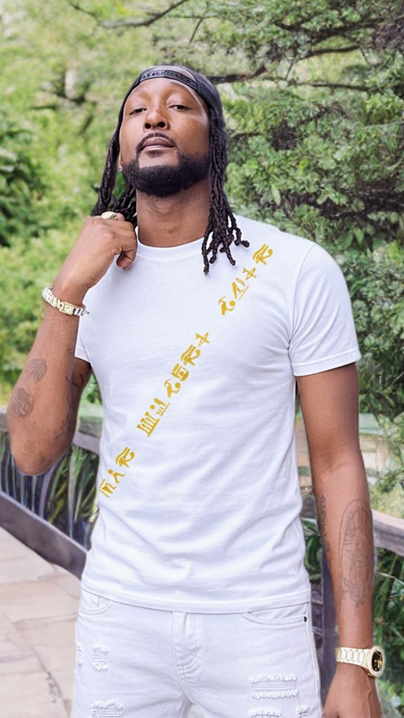 Man wearing a white t-shirt with yellow text outdoors