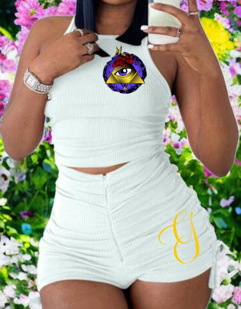 Person wearing a white outfit with a colorful logo on a floral background