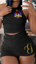 Person wearing a black outfit with a unique design on a blurred background