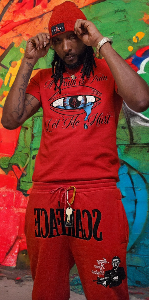 Person wearing a red outfit with graphic design in front of a colorful mural.