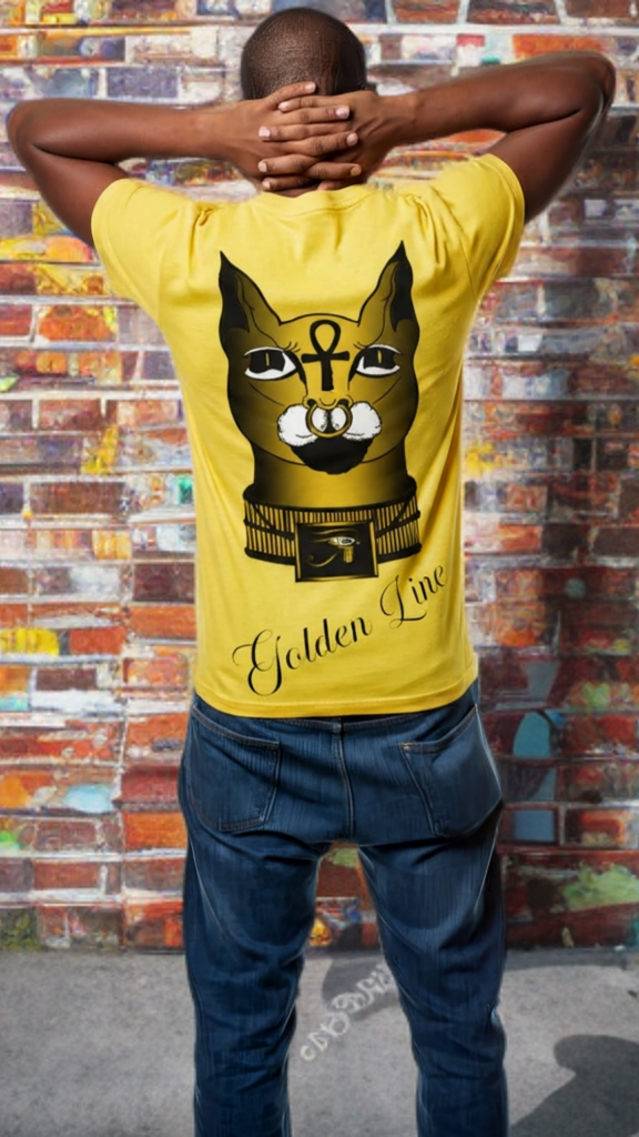 Person wearing a yellow t-shirt with a cat graphic and 'Golden Line' text, standing against a colorful brick wall.